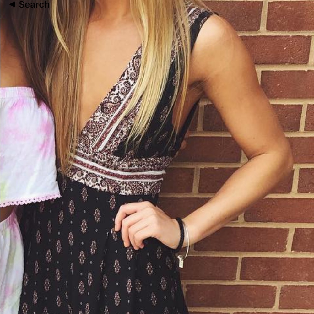 Black, pink. And maroon deep v romper